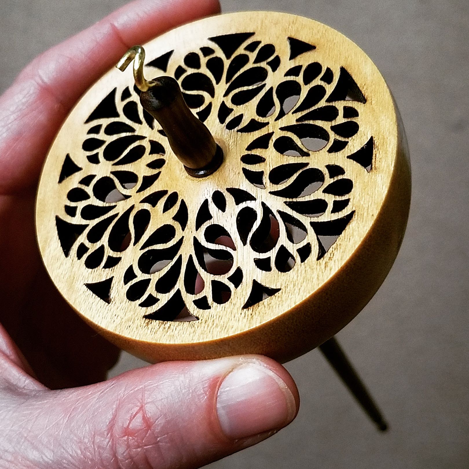 A Spanish Peacock cut out drop spindle