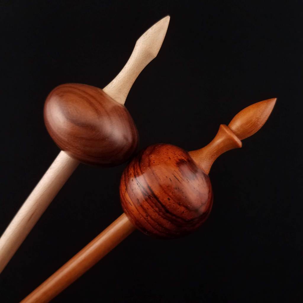 An older Spanish Peacock bead spindle tip (upper left) versus the current tip shape (lower right)