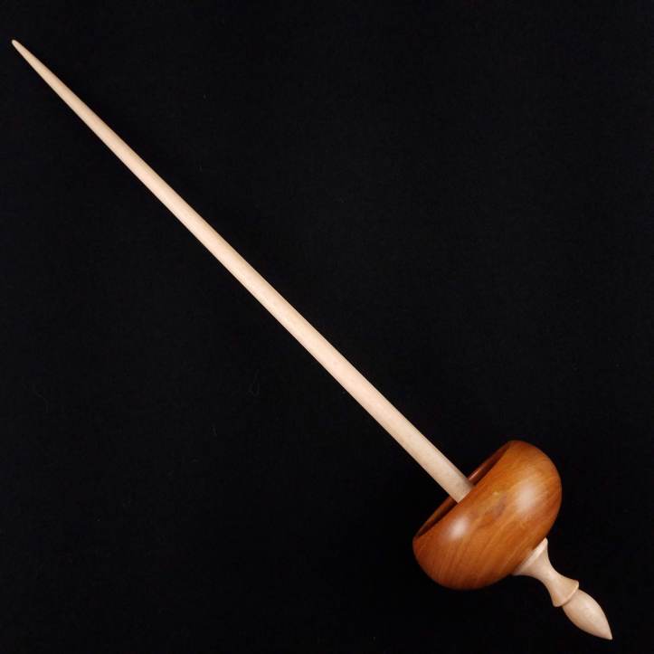 A Spanish Peacock "Bob" Tibetan spindle, featuring a chakte viga whorl on a maple shaft