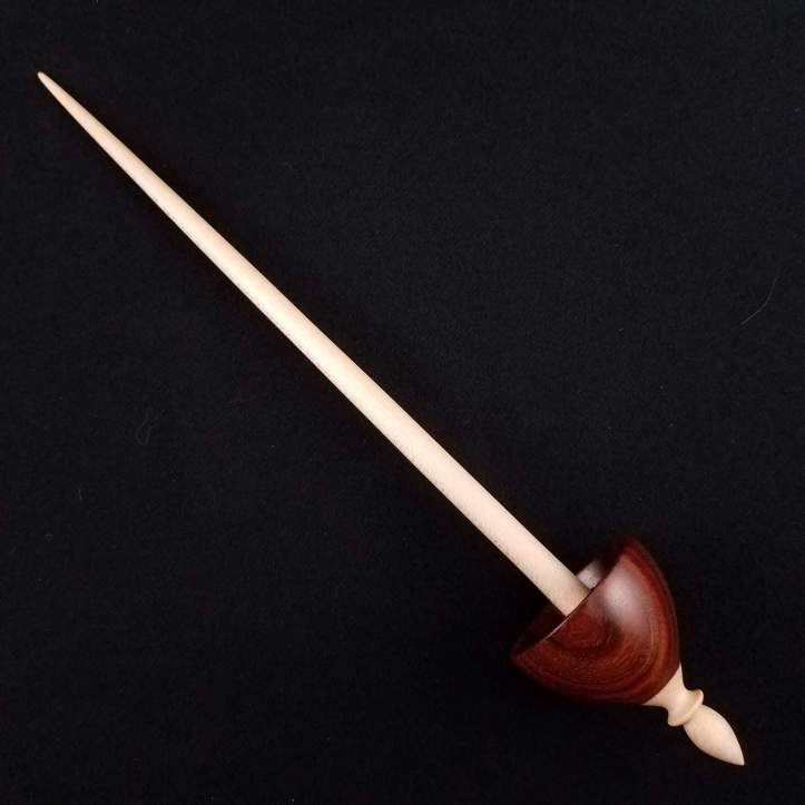 A Spanish Peacock pocket Tibetan spindle, featuring a cocobolo whorl on a maple shaft