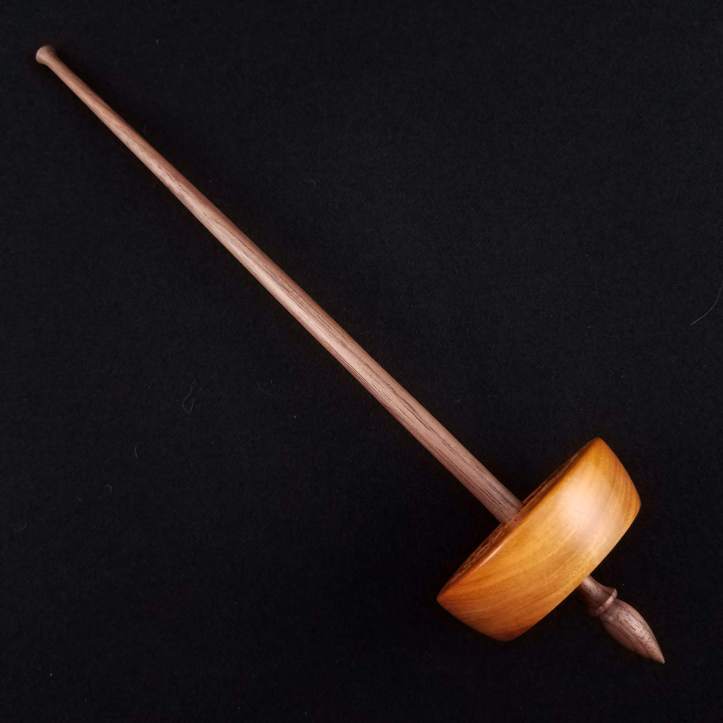 A Spanish Peacock small bottom whorl spindle, featuring a chakte viga whorl on a walnut shaft