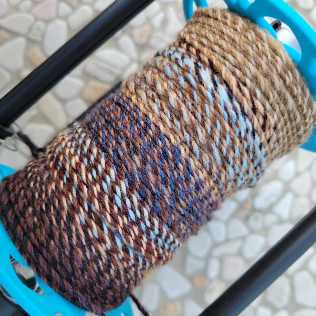 Bobbin shot while plying my fractal yarn