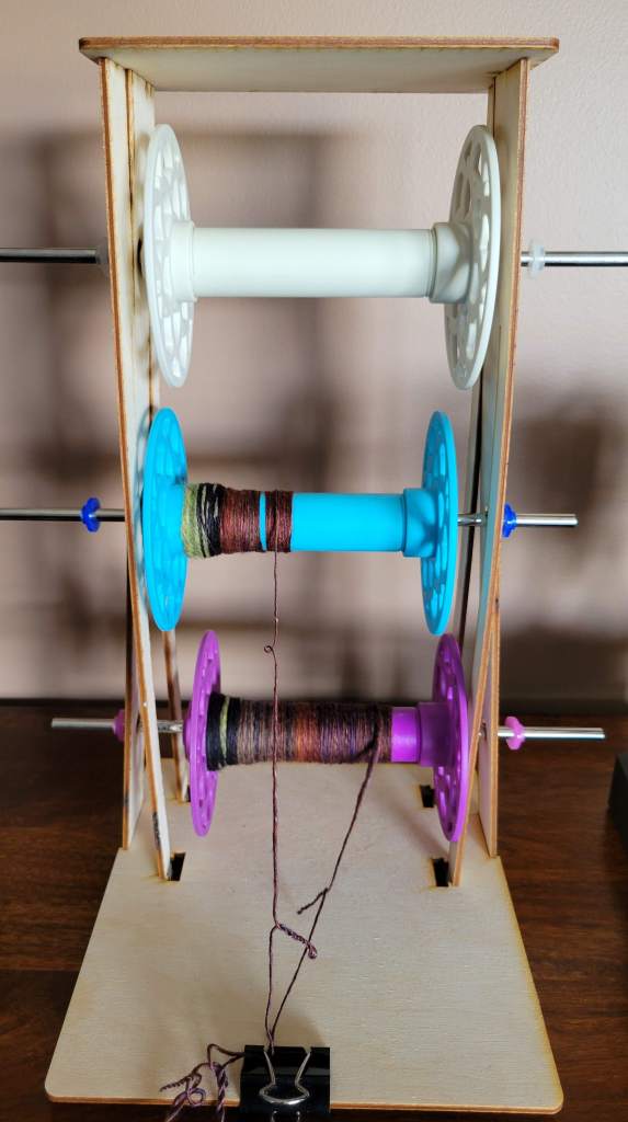My three bobbins ended up with different lengths of singles yarn, despite my OCD weighing while splitting the fiber