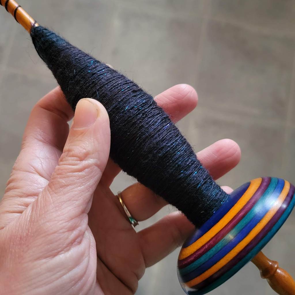 Attempting to wrap a football shaped cop on a whorled spindle required focus and concentration