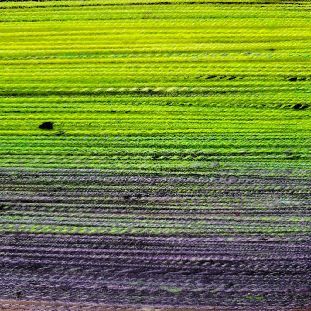 A close up of the final yarn showing the gradient from yellow to purple